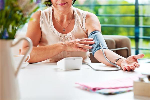 woman taking her bloodpressure