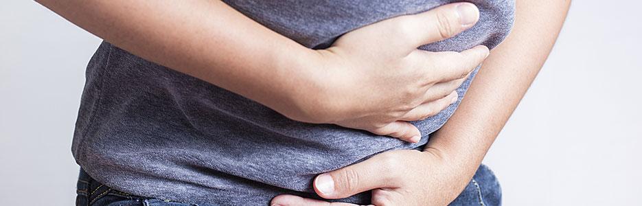 Woman holding stomach