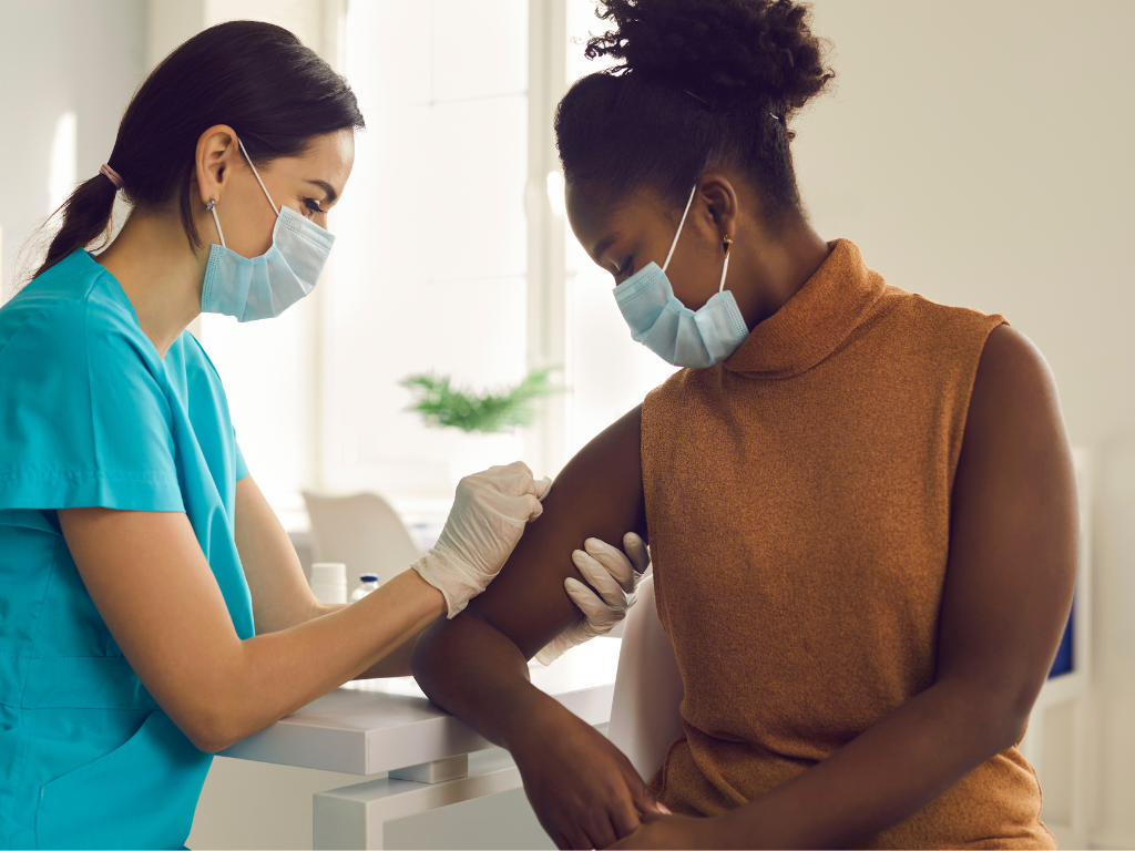 A woman getting vaccinated
