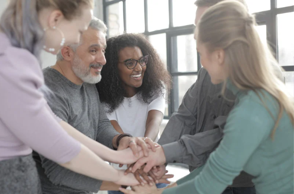 A group of people holding hands