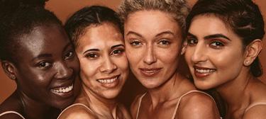 A diverse group of women smiling