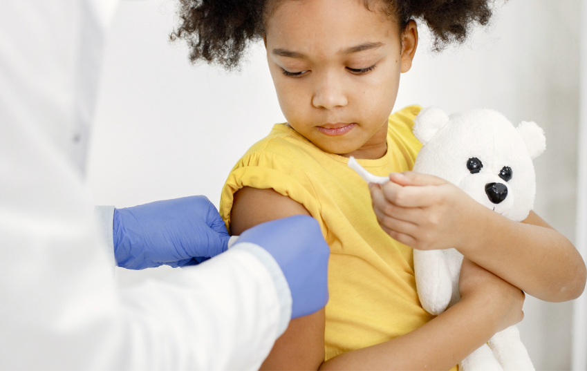 A girl getting vaccinated