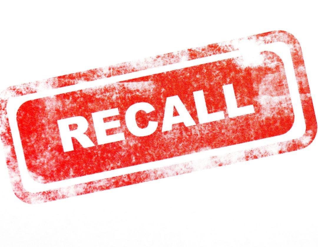 A red stamp with the word recall in it